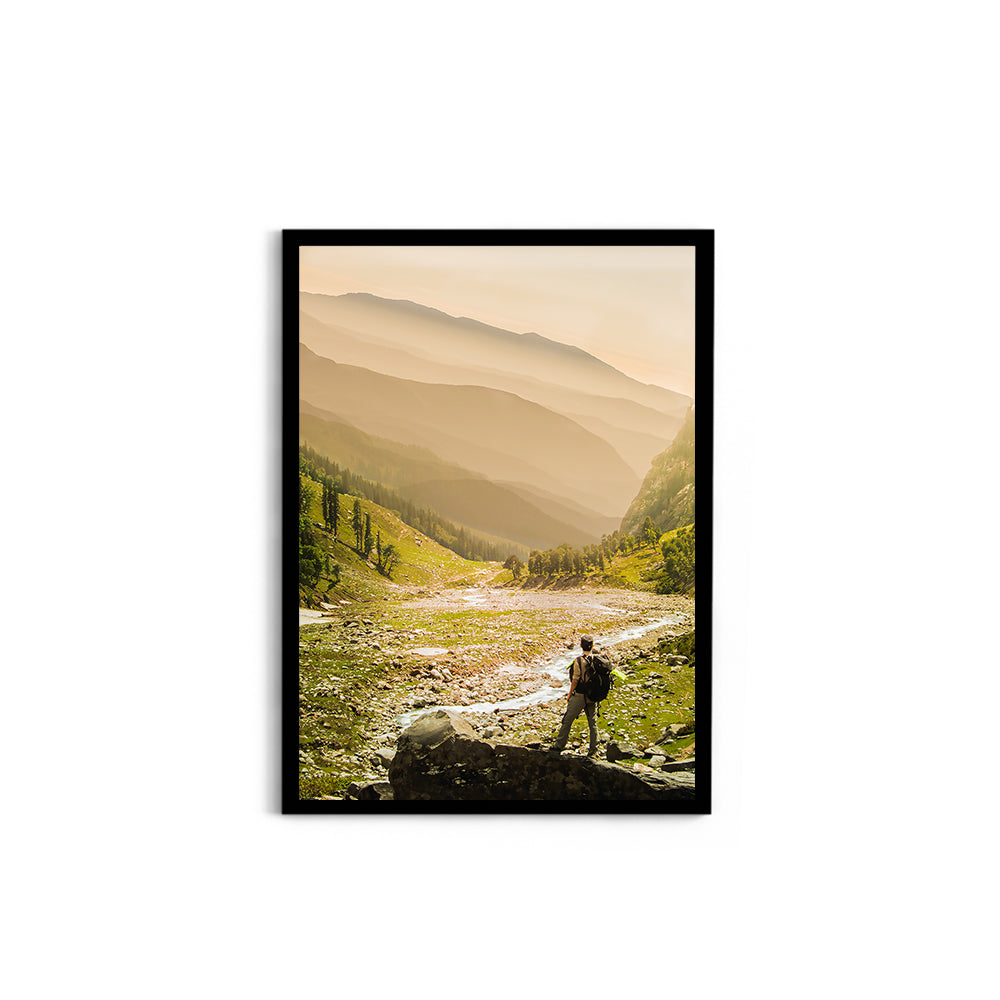 Hiker on rock end above valley - Hampta Pass