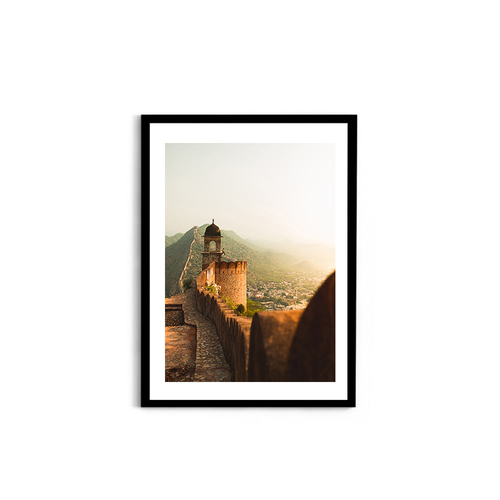 Thoughtful man sitting on a mountain enjoying the view - Jaipur