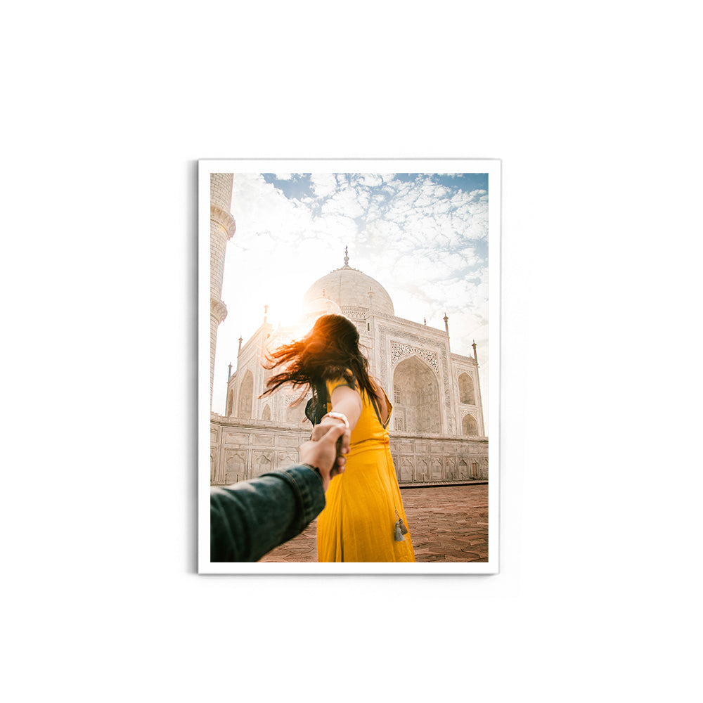 Woman holding hand in front of Taj Mahal - Taj Mahal