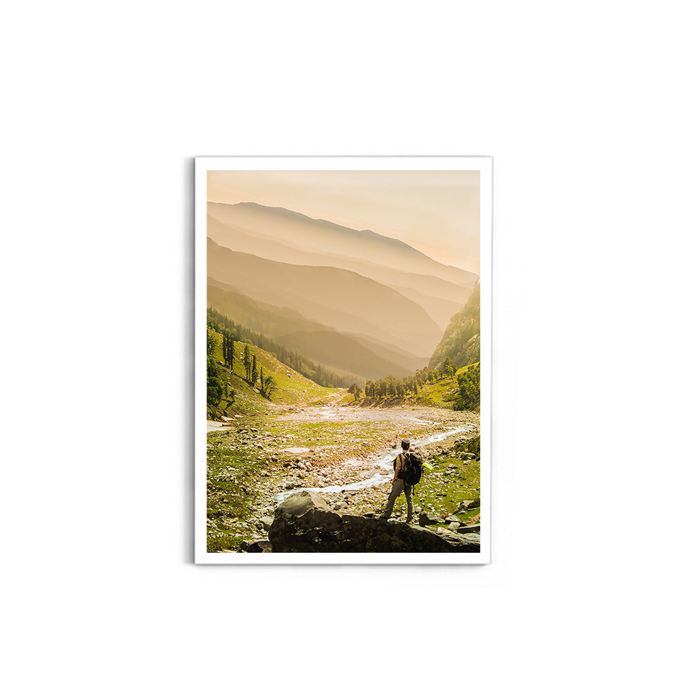 Hiker on rock end above valley - Hampta Pass