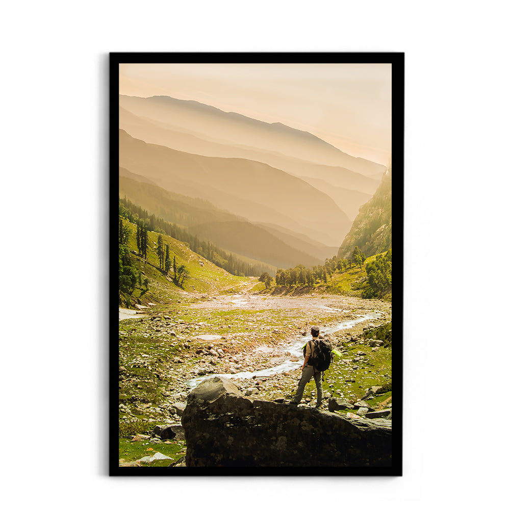 Hiker on rock end above valley - Hampta Pass
