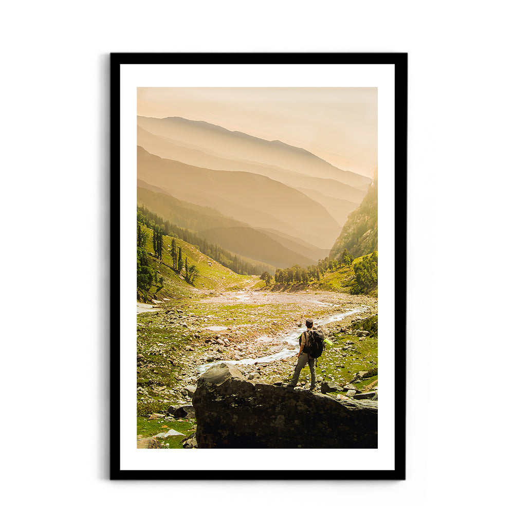 Hiker on rock end above valley - Hampta Pass