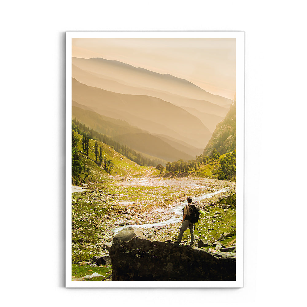 Hiker on rock end above valley - Hampta Pass