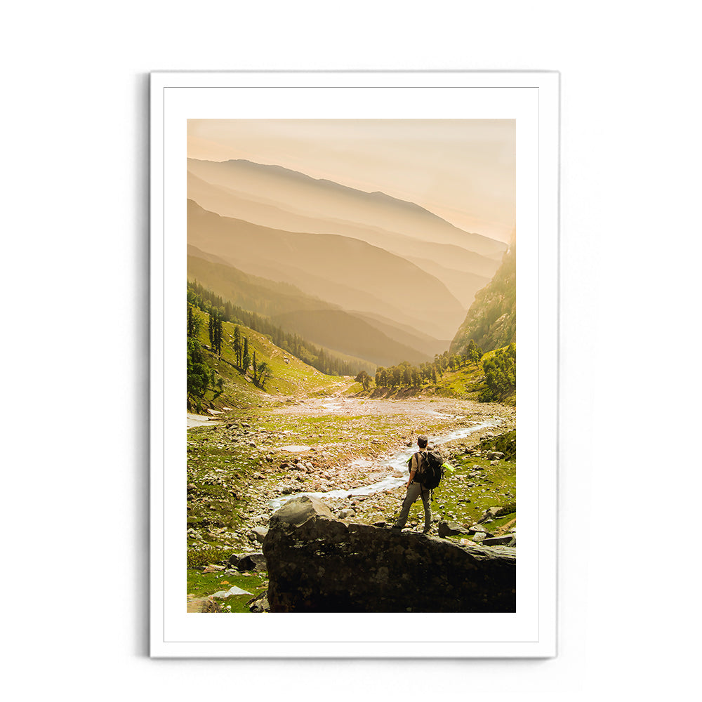 Hiker on rock end above valley - Hampta Pass